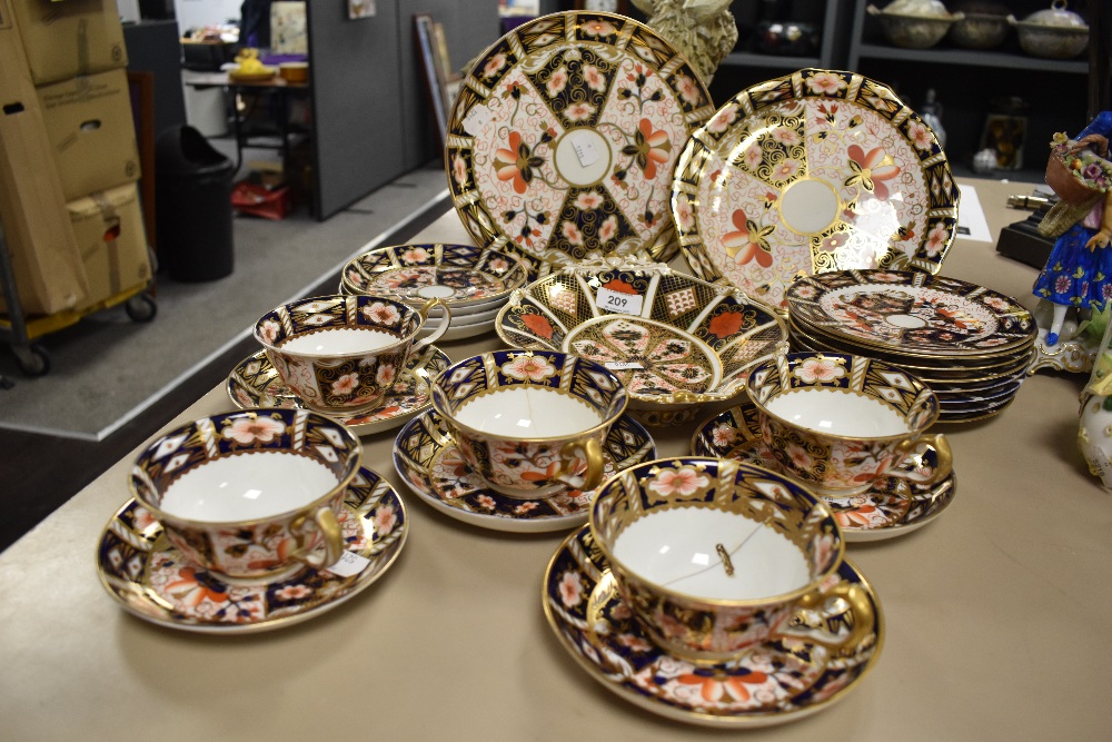 A group of Royal Crown Derby 2451 Imari pattern teawares, including plates, cups and saucers, some