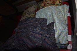 A box of mixed fabrics, various to include Paisley or Boteh design skirt