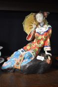 A Wanzpits Shi Wan porcelain figurine of a seated Geisha