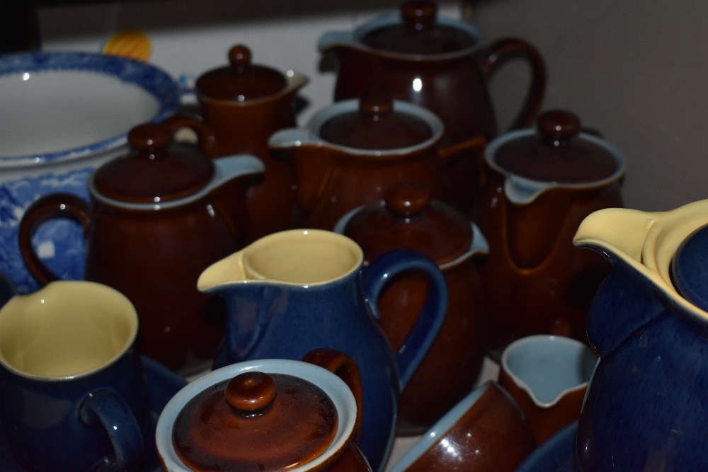 A group of Denby stoneware jugs and teapots, some saucers and plates, in blues and browns - Image 2 of 2