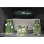 A Victorian green glaze fruit bowl with three pieces of modern studio pottery.