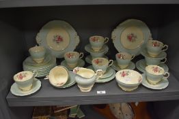 An early 20th century Paragon part tea service in a green and cream glaze