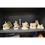 A set of nine Coalport miniature pastille burner cottages with some additional Coalport items