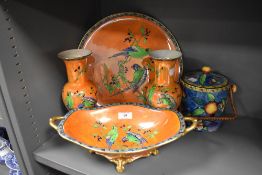 Five pieces of early 20th century Carlton ware including Parrot lustre pattern twin handled fruit
