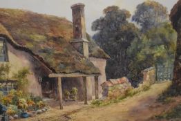 Lewis Mortimer, (19th/20th century), a watercolour, thatched country cottage, signed and dated 1920,