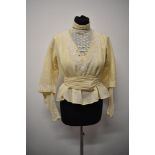 An Edwardian bodice in cream having tulle lace to bodice and lower portions of sleeves with separate