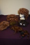 A selection of theatrical wigs and vintage new old stock hair nets.