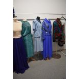 A selection of ladies 1970s and 80s clothing, including Louis Feraud dress and blouse in pale blue.