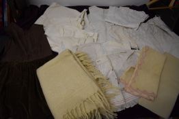 A box full of children's and babie's antique clothing, bibs and accessories etc, including brown