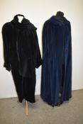 A vintage navy blue velvet cape and a black velvet Louis Feraud coat.