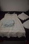 Five pairs of ladies 1940s powder blue knickers, a petticoat and two tray cloths.