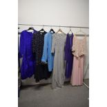 A selection of 1970s and 80s clothing, including Jean Muir coat and Jaeger dress in electric blue.