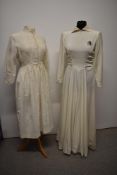 A 1930s cream wedding dress, having gathered bodice, full skirt, collar, side zip and short zips