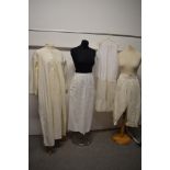 A collection of vintage and antique nightwear and similar including bloomers, nightdress and apron.