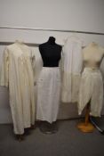 A collection of vintage and antique nightwear and similar including bloomers, nightdress and apron.