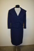 A late 1950s/ early 60s blue suit by Diane Warren, Blackpool, and a white blouse.