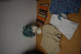 A mixed lot of items including shorts, 1960s hat, swimming trunks and 1940s apron.