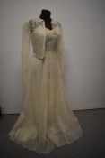 A stunning 1940s cream gown and matching jacket, dress having boned bodice and side metal zip,