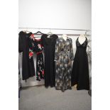 Five 1970s dresses, including black halter neck maxi dress with beadwork to bodice.