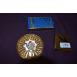 Three vintage 1940s and 50s compacts including sprung loaded case having integrated cigarette