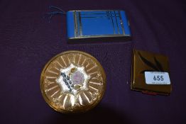 Three vintage 1940s and 50s compacts including sprung loaded case having integrated cigarette