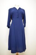 A 1930s midnight blue crepe de chine day dress, having self covered buttons to front and cuffs,