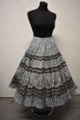 A 1950s novelty print full circle skirt in crisp cotton.