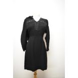 A 1940s black crepe day dress and jacket, dress having button back fastening and beading and fringed