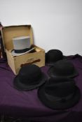 A selection of vintage gents hats, to include boxed Dunn and CO grey top hat, three black bowlers