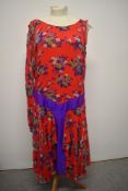 A 1930s red floral crepe dress, having dropped waist with purple accents. AF, back metal zip added