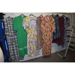 A mixed lot of predominantly 1970s and 80s dresses and skirts.