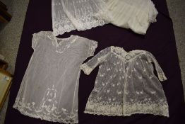 A selection of Edwardian tulle and lace baby clothes.