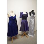 Two prom dresses and a 1980s purple party dress.