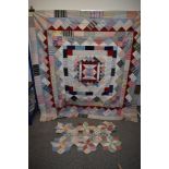 An early 20th century un backed patchwork quilt and a smaller unfinished section, both are lovely