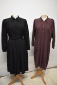 A 1930s black twill day dress/ chore dress with self covered buttons to front and belt to waist