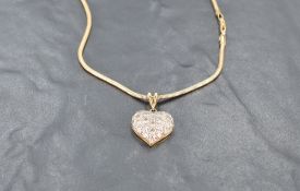 An 18ct gold diamond-set heart-shaped pendant, pave-set with twenty three small diamond brilliants