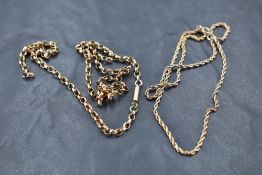 A small 9ct rose gold double chain bracelet and a piece of yellow metal broken belcher chain,