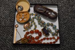 A small selection of vintage jewellery including rolled gold tie slide, collar studs, lockets,