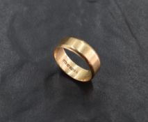 A 9ct wedding band, of plain form, marked .375, ring size R-S, 4.3grams
