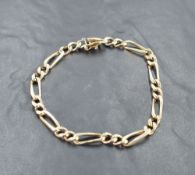 A 9ct gold Figaro bracelet, with tongue and socket clasp, marked 375 & 9k alongside London import