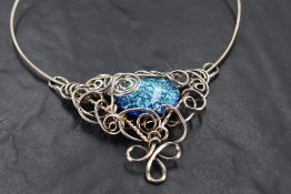 A Queen Elizabeth !! silver wire necklace, of scrolled and entwined form with central oval glass '