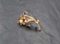 A 9ct gold and peridot flower-form brooch, marked 375, 4cm, 6.5grams