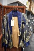 A mid century oriental smokers jacket in blue silk satin having gold thread embroidery with a set of