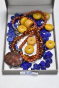 A lapis lazuli carved teardrop bead necklace, Baltic amber bracelet, amber style loose beads and