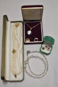 A selection of costume jewellery including earrings and pendant set, enamelled half penny on