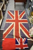 An early 20th century Union Jack having screen printed fabric with a later printed flag both