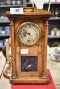 An Edwardian mahogany cased mantel clock of architectural design and inlaid design, small