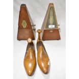 Two vintage wooden metronomes, one French with solid wood case, circa 1930s and the other German