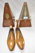 Two vintage wooden metronomes, one French with solid wood case, circa 1930s and the other German