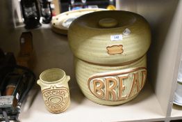 A mid century Tremar bread bin and utensil jar, inner bread bin lid having small chips to inner rim